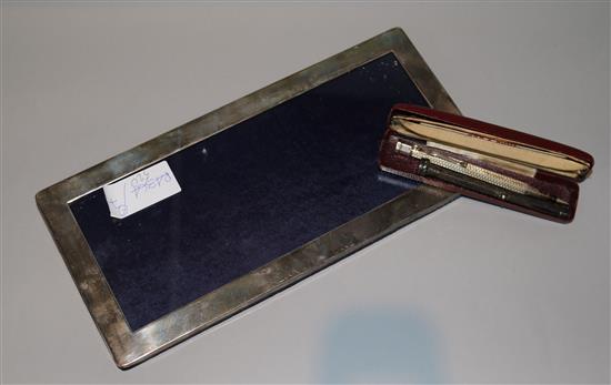 A modern silver mounted photograph frame and two propelling pencils